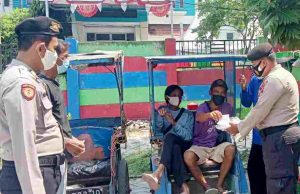 Ajak Warga Taat ProKes, Polres Kep Seribu Bagikan 1.400 Masker
